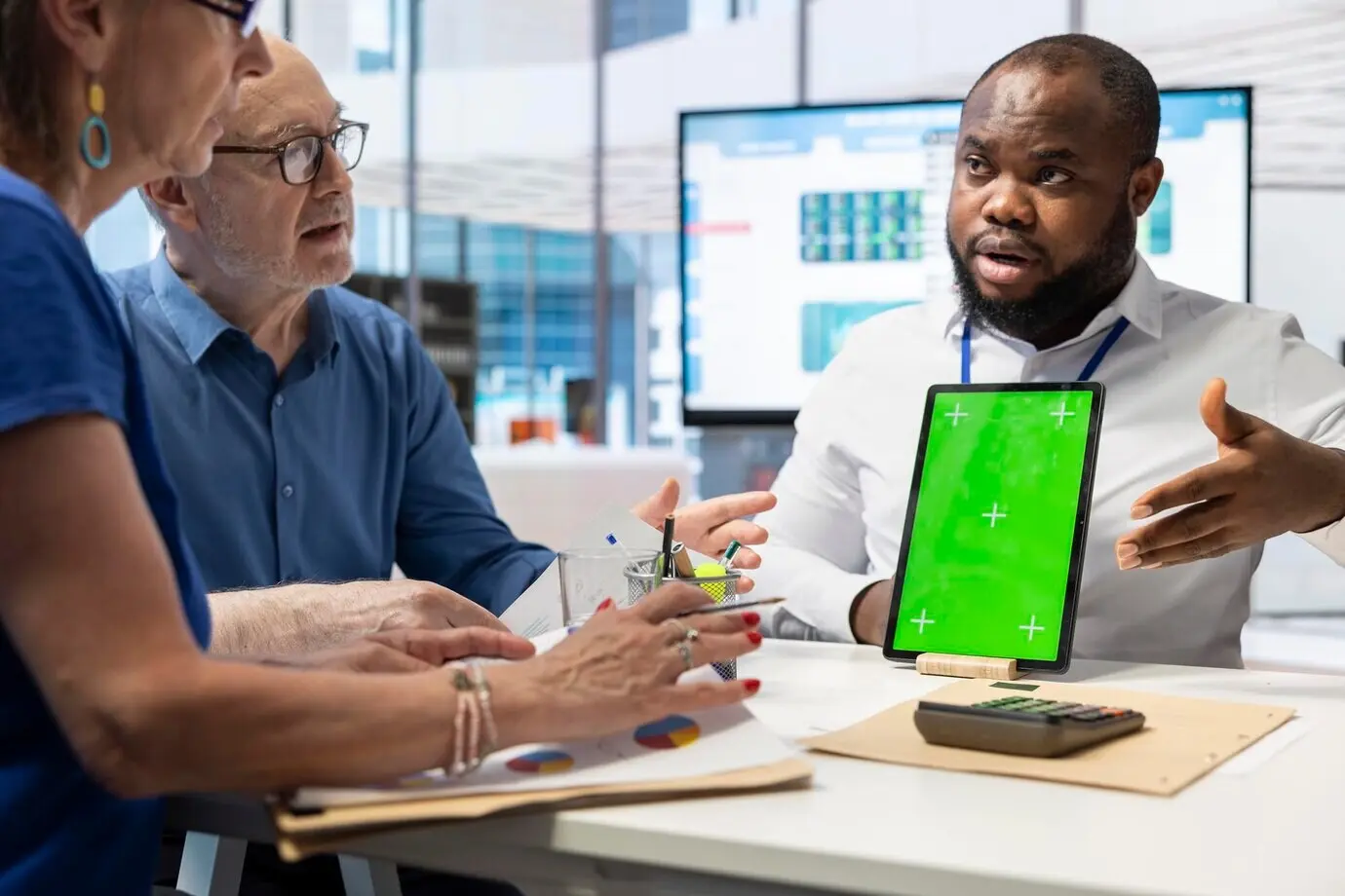 Older adults receiving expert financial guidance for retirement planning.