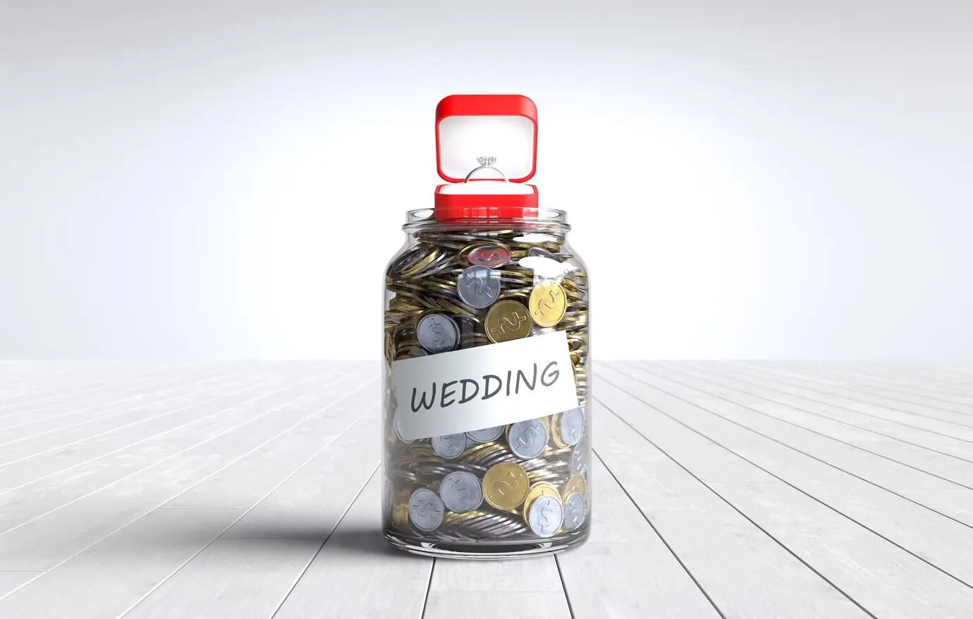 The word “Wedding” with a coin in a glass jar, saving money for the wedding reception.